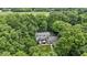 Scenic aerial view of a secluded home enveloped by mature trees, showcasing its tranquil setting and natural beauty at 10808 Greenbriar Dr, Fishers, IN 46037