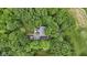 Aerial shot of a house nestled among lush green trees, offering both privacy and natural beauty at 10808 Greenbriar Dr, Fishers, IN 46037
