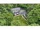Picturesque aerial view of a home nestled among dense trees, offering privacy and a serene natural setting at 10808 Greenbriar Dr, Fishers, IN 46037