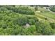Stunning aerial view of a property nestled amongst lush greenery and adjacent to a golf course at 10808 Greenbriar Dr, Fishers, IN 46037