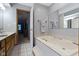 Bathroom features a soaking tub and a double sink vanity at 10808 Greenbriar Dr, Fishers, IN 46037