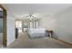 Comfortable bedroom with neutral carpeting, ceiling fan and an attached bathroom at 10808 Greenbriar Dr, Fishers, IN 46037
