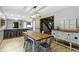 Dining area with wood table and breakfast bar at 10808 Greenbriar Dr, Fishers, IN 46037