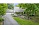 Beautiful home featuring a covered front porch, attached two-car garage, and lush landscaping for great curb appeal at 10808 Greenbriar Dr, Fishers, IN 46037
