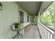 Charming covered front porch with plenty of space for seating, showcasing a tranquil outdoor living area at 10808 Greenbriar Dr, Fishers, IN 46037