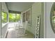 Inviting covered front porch with rocking chairs, a welcome sign, and charming curb appeal at 10808 Greenbriar Dr, Fishers, IN 46037