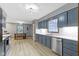 Spacious kitchen with stainless steel appliances, white subway tile backsplash, and wood floors at 10808 Greenbriar Dr, Fishers, IN 46037