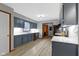 Updated kitchen with white countertops and blue cabinets and stainless steel appliances at 10808 Greenbriar Dr, Fishers, IN 46037