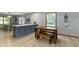 Kitchen island with seating and wood table at 10808 Greenbriar Dr, Fishers, IN 46037