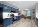 Kitchen featuring stainless steel appliances, white subway tile backsplash, and wood floors at 10808 Greenbriar Dr, Fishers, IN 46037