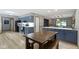 Open kitchen featuring an island and wooden dining table at 10808 Greenbriar Dr, Fishers, IN 46037