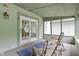 Relaxing screened-in porch with string lights, seating, and stylish rug for outdoor comfort at 10808 Greenbriar Dr, Fishers, IN 46037