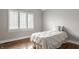 Cozy bedroom with hardwood floors and a bright window at 11875 Durbin Dr, Carmel, IN 46032