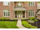 Inviting front porch with a wreath and flower pots adding charm to this well-maintained home at 11875 Durbin Dr, Carmel, IN 46032