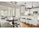 Eat-in kitchen features stainless appliances, white cabinets and access to a screened in porch at 11875 Durbin Dr, Carmel, IN 46032