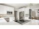 Open concept kitchen and eat-in area featuring white cabinets, granite countertops, and stainless appliances at 11875 Durbin Dr, Carmel, IN 46032