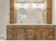 Elegant main bathroom with a dual vanity and granite countertop at 11875 Durbin Dr, Carmel, IN 46032