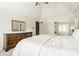Bright main bedroom with a dresser, slider doors and a black interior door at 11875 Durbin Dr, Carmel, IN 46032