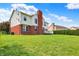 Backyard view of two-story brick and vinyl home at 12635 Tuscany Blvd, Carmel, IN 46032