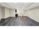 Spacious finished basement with wet bar, recessed lighting, and modern gray vinyl flooring at 12635 Tuscany Blvd, Carmel, IN 46032