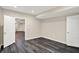 View of the basement bedroom showing modern gray vinyl flooring and doors at 12635 Tuscany Blvd, Carmel, IN 46032