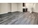 Finished basement with dark wood-look flooring and wet bar at 12635 Tuscany Blvd, Carmel, IN 46032