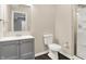 Bathroom with modern vanity, toilet, shower, and dark brown flooring at 12635 Tuscany Blvd, Carmel, IN 46032