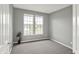 Serene bedroom featuring neutral paint, two windows overlooking a pond and plush carpeting at 12635 Tuscany Blvd, Carmel, IN 46032