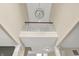 This grand foyer showcases an overhead view with oak railing and a decorative light fixture at 12635 Tuscany Blvd, Carmel, IN 46032