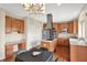 Bright kitchen with stainless steel appliances, central island and wooden cabinets, seamlessly blending functionality and style at 12635 Tuscany Blvd, Carmel, IN 46032