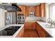 A modern kitchen with stainless steel appliances and island cooktop, perfect for culinary enthusiasts at 12635 Tuscany Blvd, Carmel, IN 46032