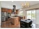 Modern kitchen featuring stainless steel appliances and a central island perfect for cooking and entertaining at 12635 Tuscany Blvd, Carmel, IN 46032
