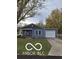 Charming single-story home featuring blue siding, a covered front porch, attached garage and a well-maintained lawn at 1321 Lennox St, Anderson, IN 46012