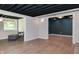 Open-concept basement with hardwood flooring, recessed lighting, and neutral paint provides a spacious and inviting atmosphere at 138 Plaza Chica St, Greenwood, IN 46143
