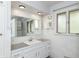 Bathroom with a large mirror, white cabinets, and ample counter space at 138 Plaza Chica St, Greenwood, IN 46143