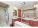 Bathroom featuring a walk-in shower, tub, and dual sink vanities at 138 Plaza Chica St, Greenwood, IN 46143