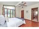 Bright bedroom with large windows, hardwood floors, and ceiling fan at 138 Plaza Chica St, Greenwood, IN 46143