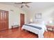 Bedroom with hardwood floors, ceiling fan, and comfortable furnishings at 138 Plaza Chica St, Greenwood, IN 46143