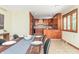 Spacious kitchen with wood cabinets, tile backsplash, stainless steel appliances, and hardwood floors at 138 Plaza Chica St, Greenwood, IN 46143