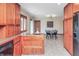 Bright kitchen with wood cabinets, stainless steel appliances, tile floors, and an adjacent dining area at 138 Plaza Chica St, Greenwood, IN 46143