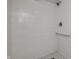 Shower area with white subway tile, shower head, and soap shelf is clean and functional at 138 Plaza Chica St, Greenwood, IN 46143