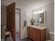 Bathroom with wood cabinets, a white countertop and a decorative mirror for a clean and functional space at 1524 Northcrest Dr, Anderson, IN 46012