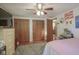 Bedroom featuring a decorative closet and a view to the bathroom and adjacent to the bed at 1524 Northcrest Dr, Anderson, IN 46012