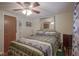 Bedroom featuring soft carpet, a ceiling fan, and large mirror above the bed for a comfortable space at 1524 Northcrest Dr, Anderson, IN 46012