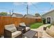 Cozy backyard seating area with comfortable outdoor furniture and privacy fence at 1623 Hoyt Ave, Indianapolis, IN 46203