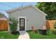 Quaint backyard featuring string lights, Adirondack chairs, and a well-manicured lawn at 1623 Hoyt Ave, Indianapolis, IN 46203