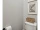 Modern bathroom with white fixtures, natural-tone walls, and decorative accents at 1623 Hoyt Ave, Indianapolis, IN 46203