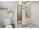 Elegant bathroom showcasing a bathtub with a stylish shower curtain and decorative tile at 1623 Hoyt Ave, Indianapolis, IN 46203