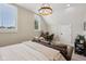 Cozy bedroom area featuring a sleeper sofa, decorative lighting, and home office space at 1623 Hoyt Ave, Indianapolis, IN 46203