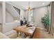 Cozy dining room with wooden table, bench seating and staircase at 1623 Hoyt Ave, Indianapolis, IN 46203